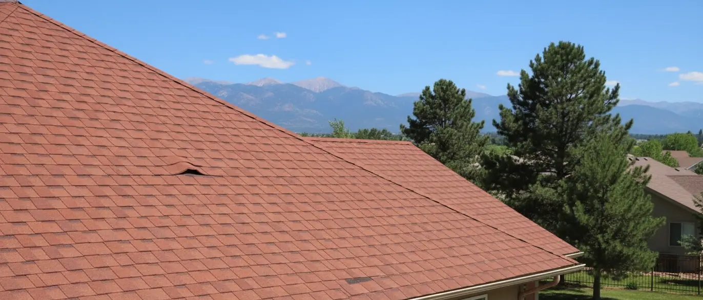 Lifted shingle edge on roof after Colorado Springs wind events